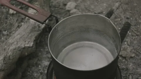 A pot on a fire, the water is boiling Stock Footage 139049080