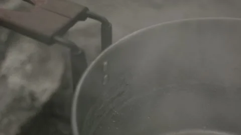 A pot on a fire, the water is boiling Stock Footage 139049196