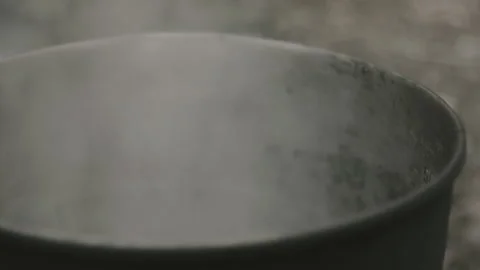 A pot on a fire, the water is boiling Stock Footage 139049274