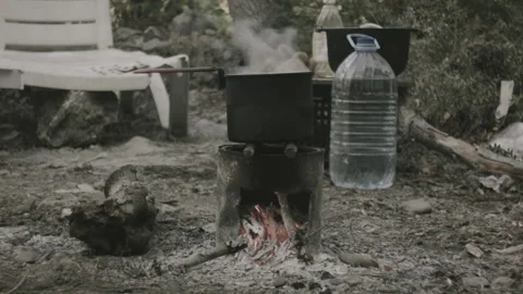 A pot on a fire, the water is boiling Stock Footage 139049418