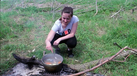 Pot with fish soup, fish soup on fire outside Stock Footage 24869289