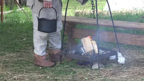 Pot with food on open fire Stock Footage 69735915