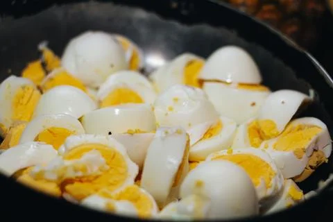 Pot full of boiled eggs in the kitchen to prepare a delicious Colombian tamal Stock Photos