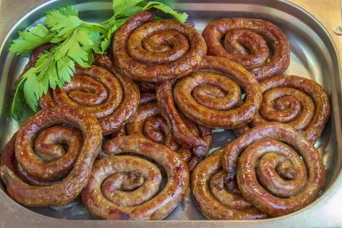 A pot full of grilled sausages. 스톡 사진