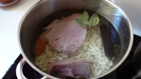 Pot on a hob ready to cook white beans Stock Footage 285949901