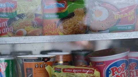 Pot instant noodle stand close up small business Asia Indonesia Slow Motion Stock Footage 102339941