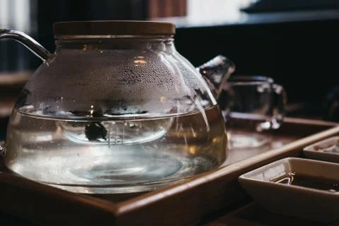 Pot of jasmine tea on a table. Stock Photos