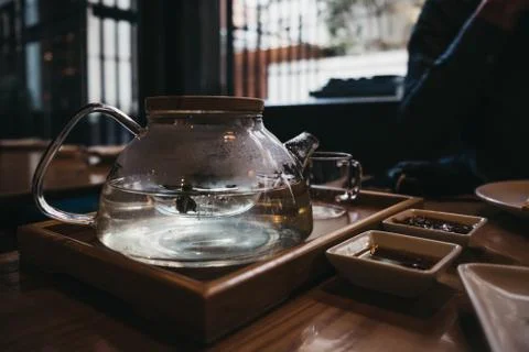 Pot of jasmine tea on a table. Stock Photos