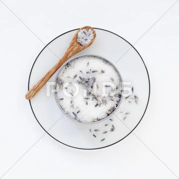 A pot of lavender sugar on a saucer with a spoon Stock Photos