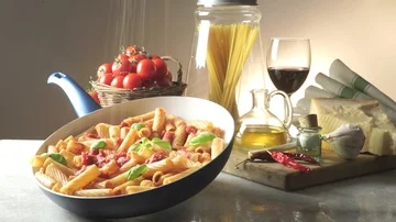 Pot with macaroni on the kitchen table 스톡 동영상 85595519