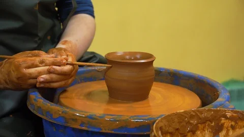 Pot maker using his hands makes pottery,at small home workshop. traditional pot  Stock Footage 99773251