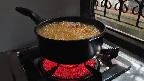 The pot of noodles on the stove is boiling. Stock Footage 252014302