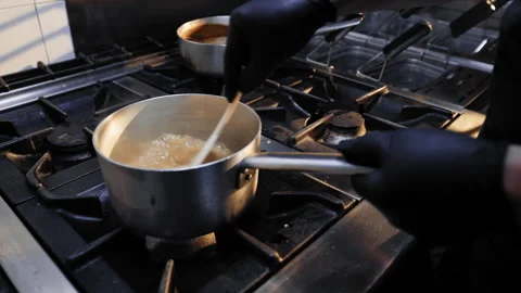 Pot on the professional stove Stock Footage 268718836