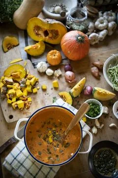Pot of pumpkin soup on a table Stock Photos