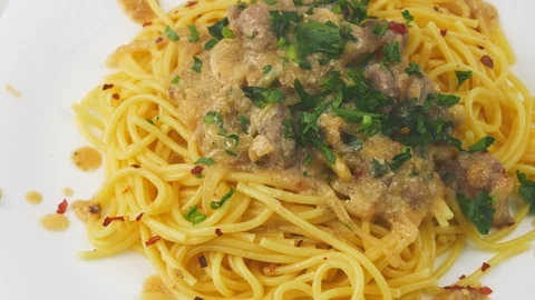 Pot roast with a side dish of pasta.Creamy sauce with onion and parsley.Close-up 스톡 동영상 128701846