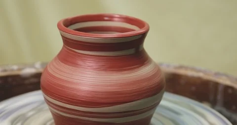 Pot rotating on pottery wheel. Just painted with brush Stock Footage 127398635