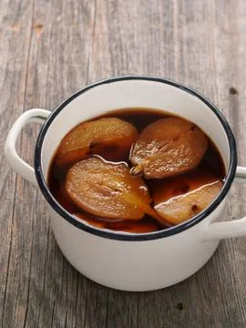 Pot of rustic poached pear Stock Photos