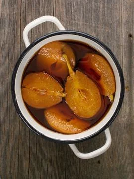 Pot of rustic poached pear Stock Photos