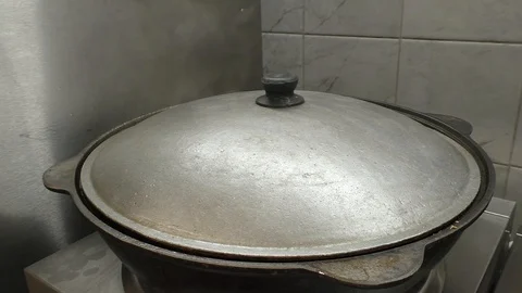 A pot that is steaming on a table Video stock 129578705