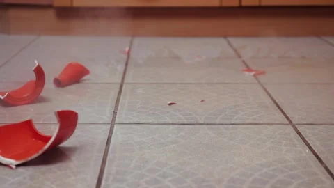 Pot of tea hitting the ground Stock Footage 219346214