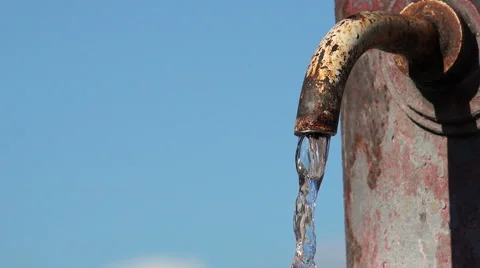Potable water flowing with blue sky in background  Video stock 56149735