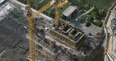 Potain tower cranes operating at a Dubai construction site timelapse Stock Footage 340441394