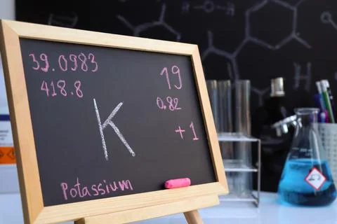 Potassium and symbol structural formula chemical write on the blackboard Stock Photos