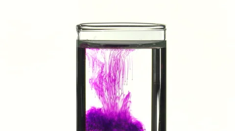 Potassium permanganate fall in water of a test tube Video stock 64291703