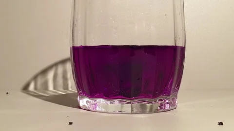 Potassium permanganate in water Stock Footage 101402118