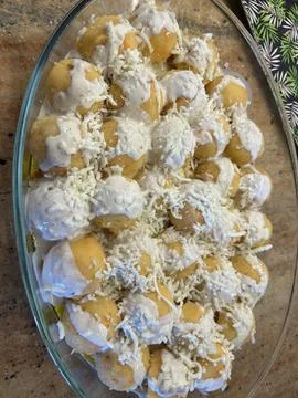 Potato Balls in Cream Sauce with Cheese - Baked Dish Stock Photos