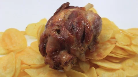 Potato bed with roasted pork knuckle Stock Footage 104752697