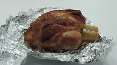 Potato bed with roasted pork knuckle Stock Footage 104752741