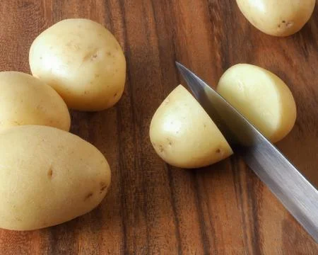 Potato Being Cut Stock Photos