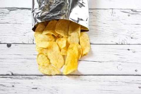 Potato Chips and pack. Packaging of Chip on white background. Top view Stock Photos