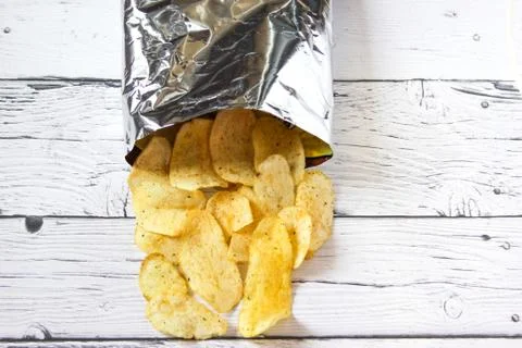 Potato Chips and pack. Packaging of Chip on white background. Top view. Stock Photos