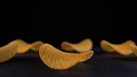 Potato chips are on the table and shaking. Pringles. Lays. 4k Stock Footage 94101152