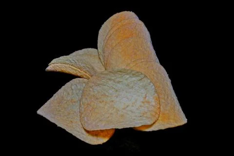 Potato chips with bacon on black background Stock-Fotos