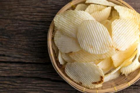 Potato chips in a basket Stock Photos