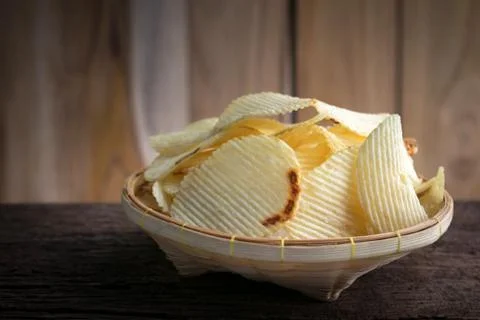 Potato chips in a basket Stock Photos