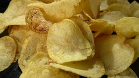 Potato chips on a black background close-up. Stock Footage 149051186