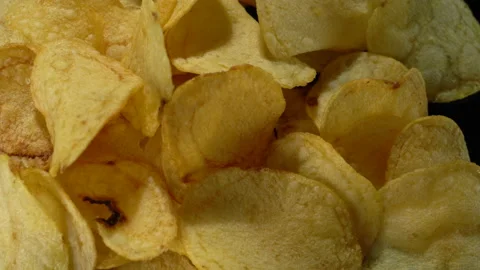 Potato chips on a black background close-up. Stock Footage 149051978