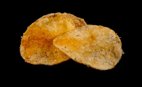 Potato chips on a black background Foto stock