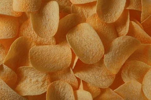 Potato chips in direct sunlight for background Stock Photos