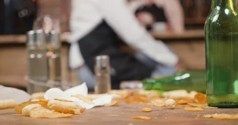 Potato chips on a dirty table in a small restaurant Stock Footage 104868882
