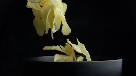 Potato Chips falling down to the bowl. slow motion shot 스톡 동영상 114725132