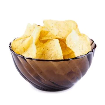 Potato chips falling in the plate. Isolated on white background Stock Photos