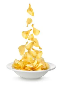 Potato chips falling in the plate Stock Photos