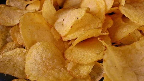 Potato Chips Fast Food Stack Pile of Chips Unhealthy Snack on rotating Stock Footage 121994393