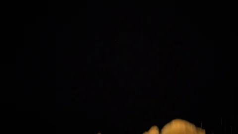 Potato chips in free fall on a black background Stock Footage 94084701