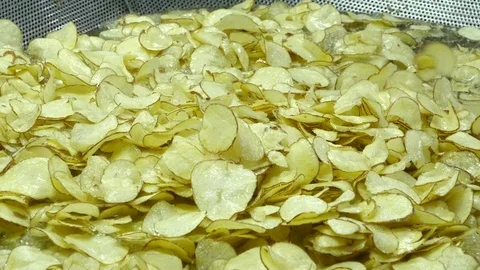 Potato chips fried in oil Stock Footage 104365959